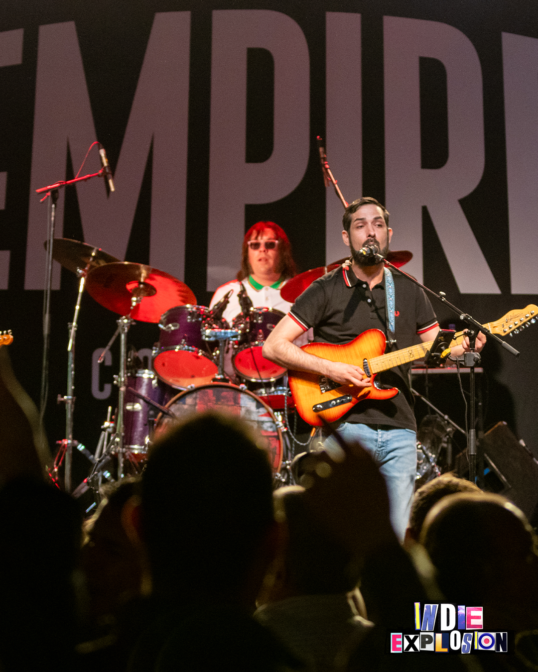 band on stage at indie explosion