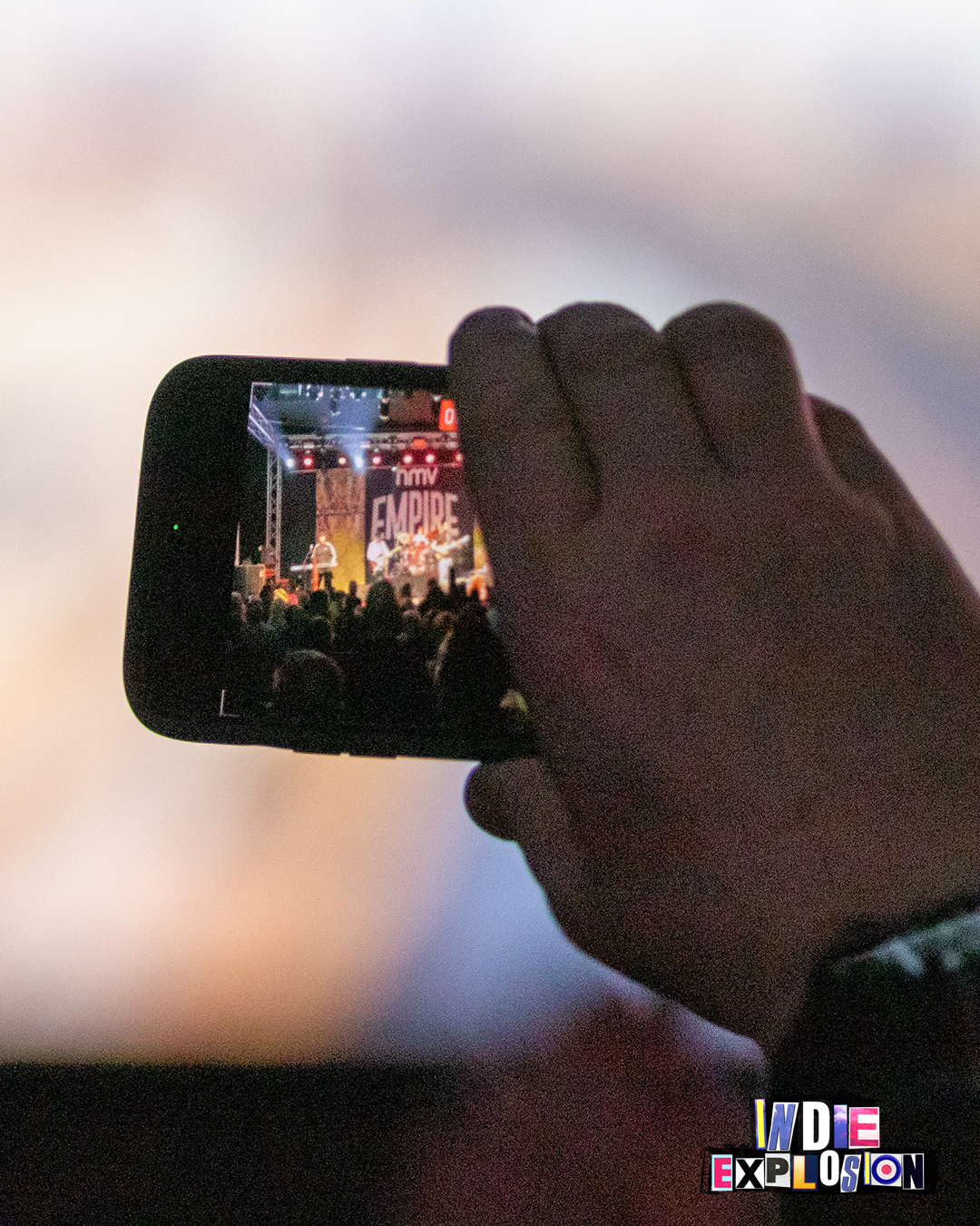 close up of audience members phone at indie explosion